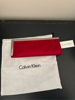 Brand new! Calvin Klein Metallic Trim Red Satin Clutch